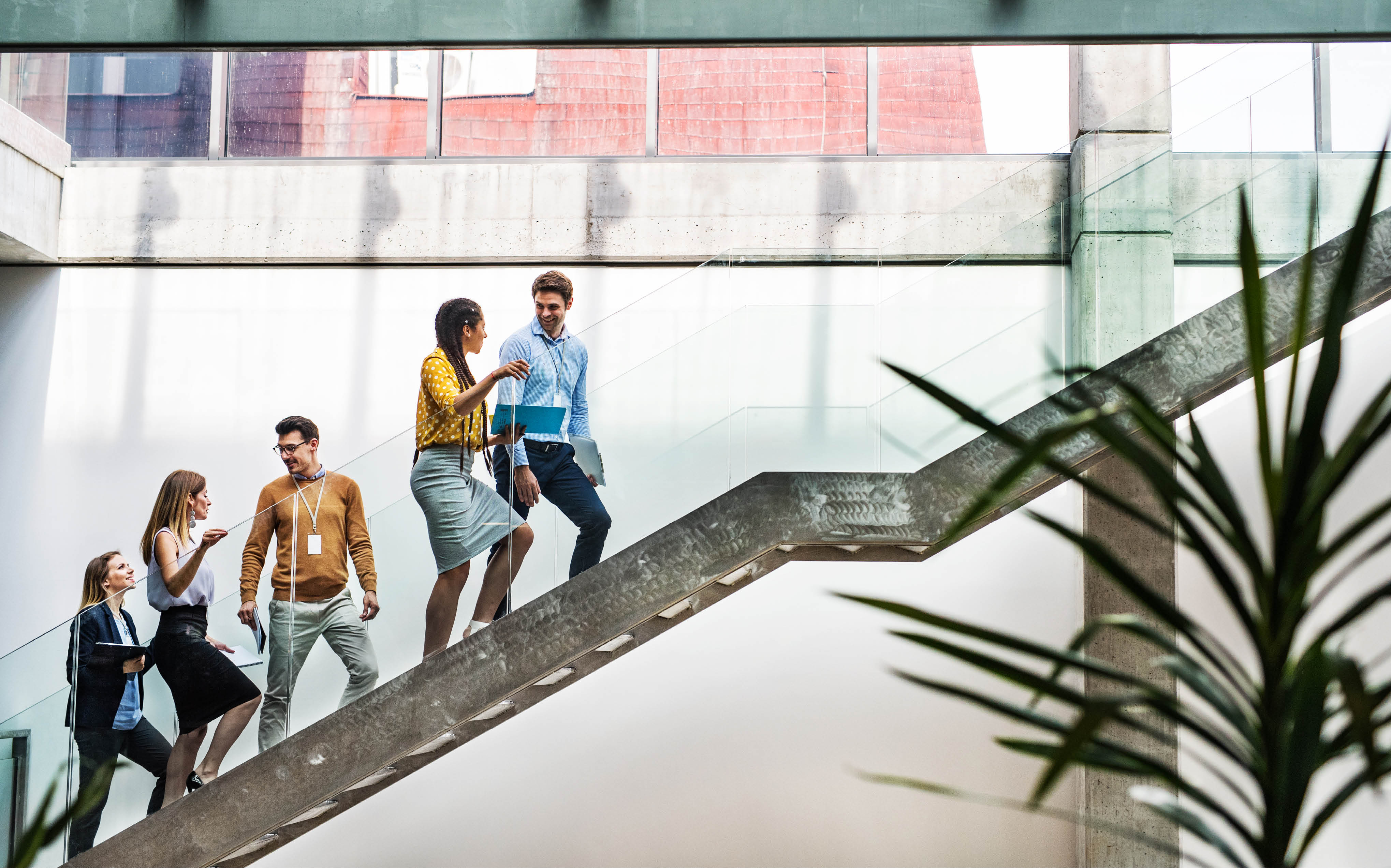 Attractive men and women after a training or a conference. Employee education concept.