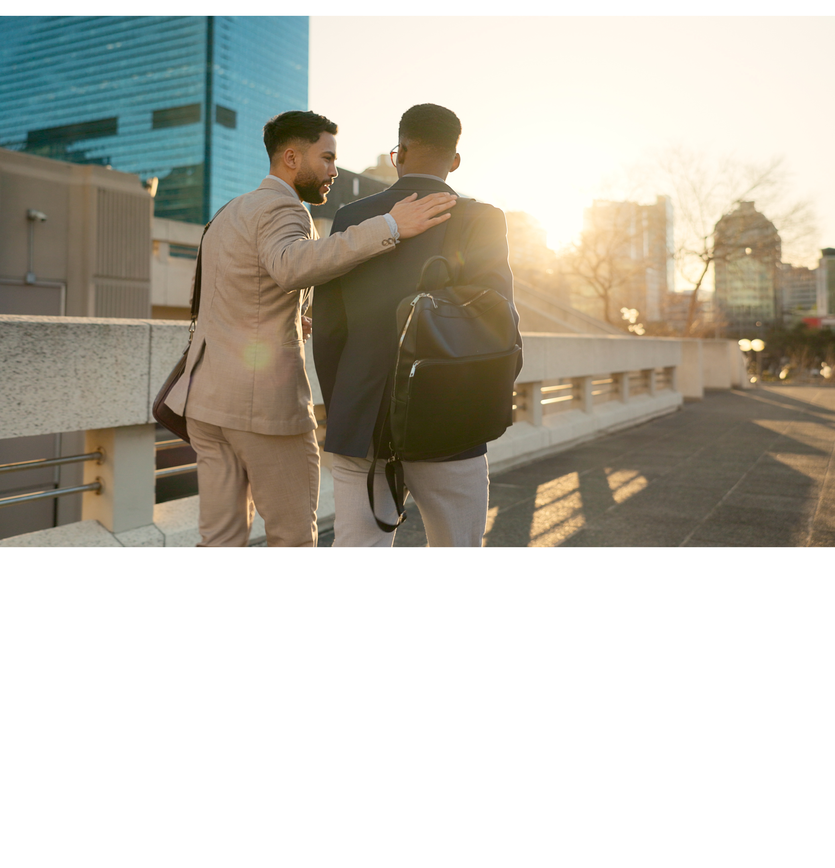 Business, men and walking in street with support in city for partnership, collaboration and teamwork. Professional, people and outdoor by buildings for travel, commute and conversation and diversity