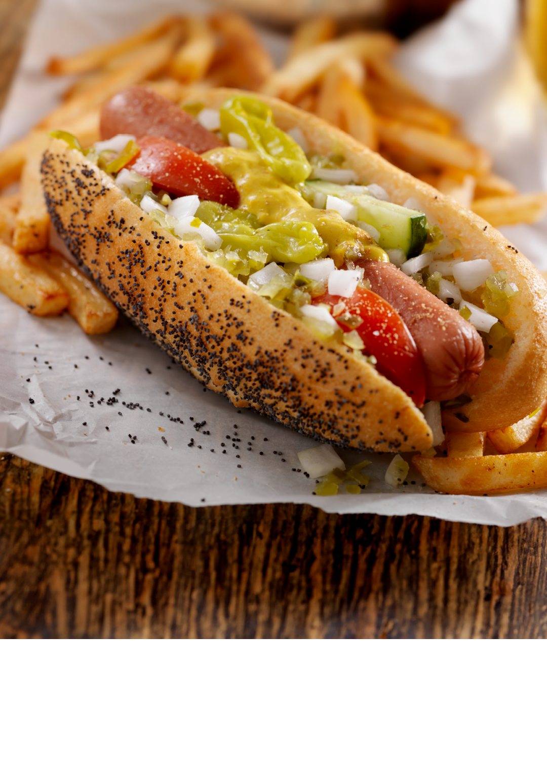 A Classic Chicago Dog with Fries and a Beer - The Chicago Dog has a Steamed Poppyseed Bun, Fresh Tomatoes, Diced Onions, Neon Green Relish,Peppers,Pickle, Yellow Mustard and a Dash of Celery Salt- Photographed on Hasselblad H3D2-39mb Camera
