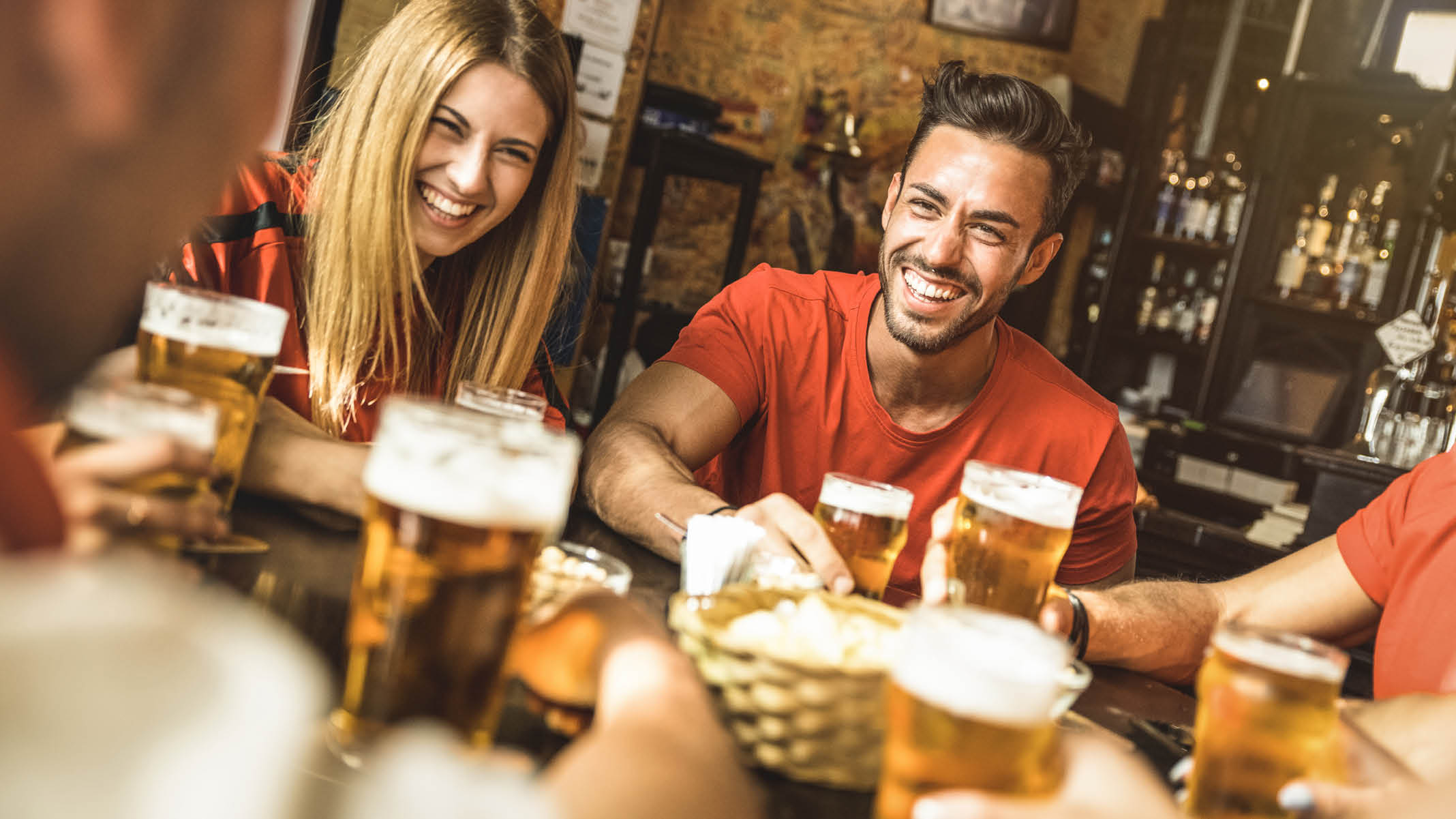 Happy friends group drinking beer at brewery bar restaurant - Friendship concept with young people enjoying time together and having genuine fun at cool vintage pub - Focus on guy - High iso image