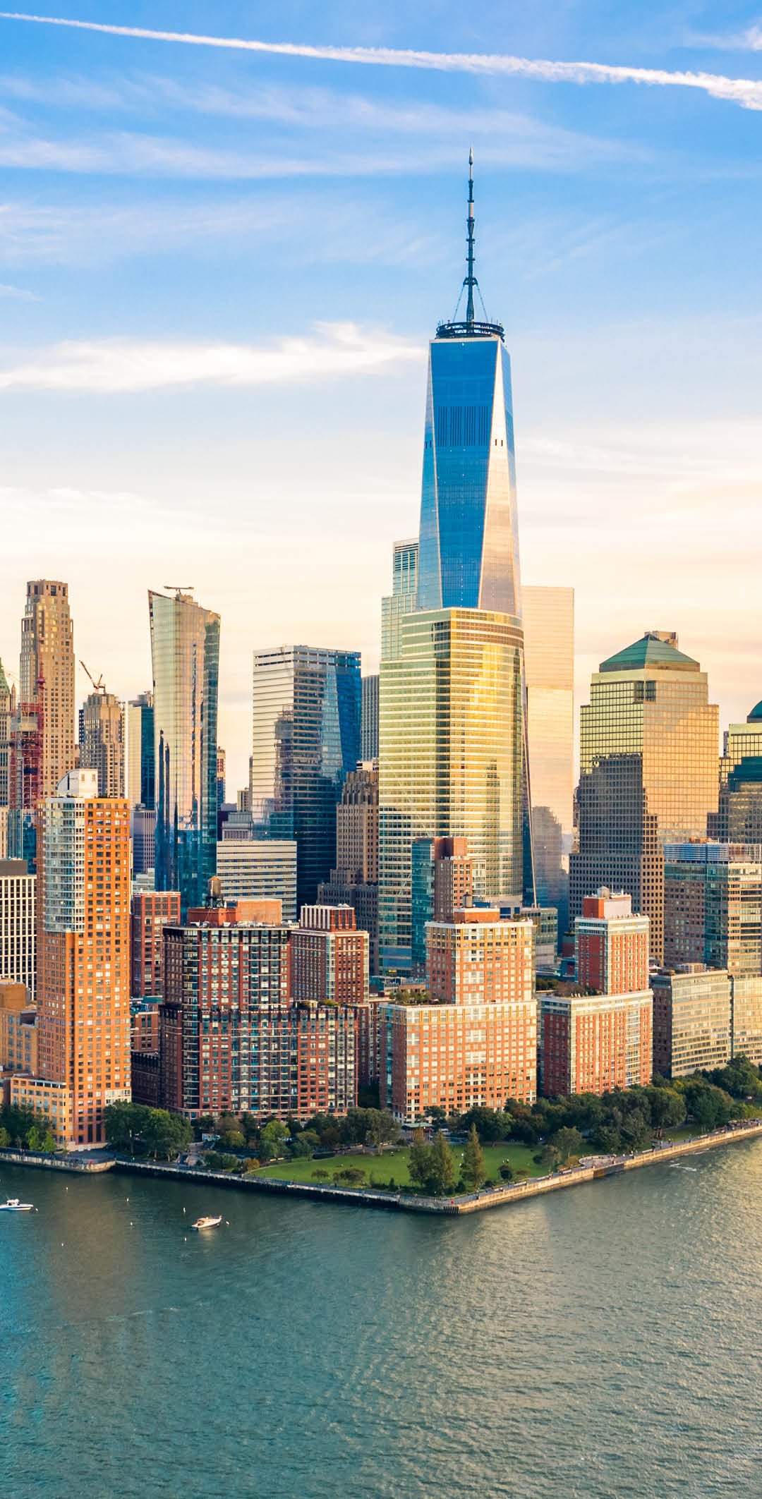 Aerial view with Lower Manhattan skyline at sunset viewed from above Hudson River