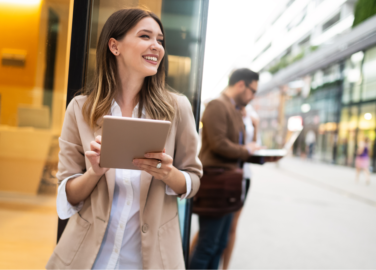 Urban business woman using tablet computer and working