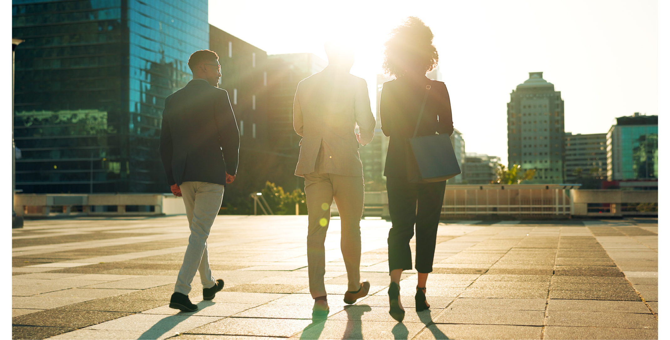 Back, business team and walking outdoor in city for morning travel to work, conversation and lens flare. Rear View, professional workers and moving in urban town with communication and networking