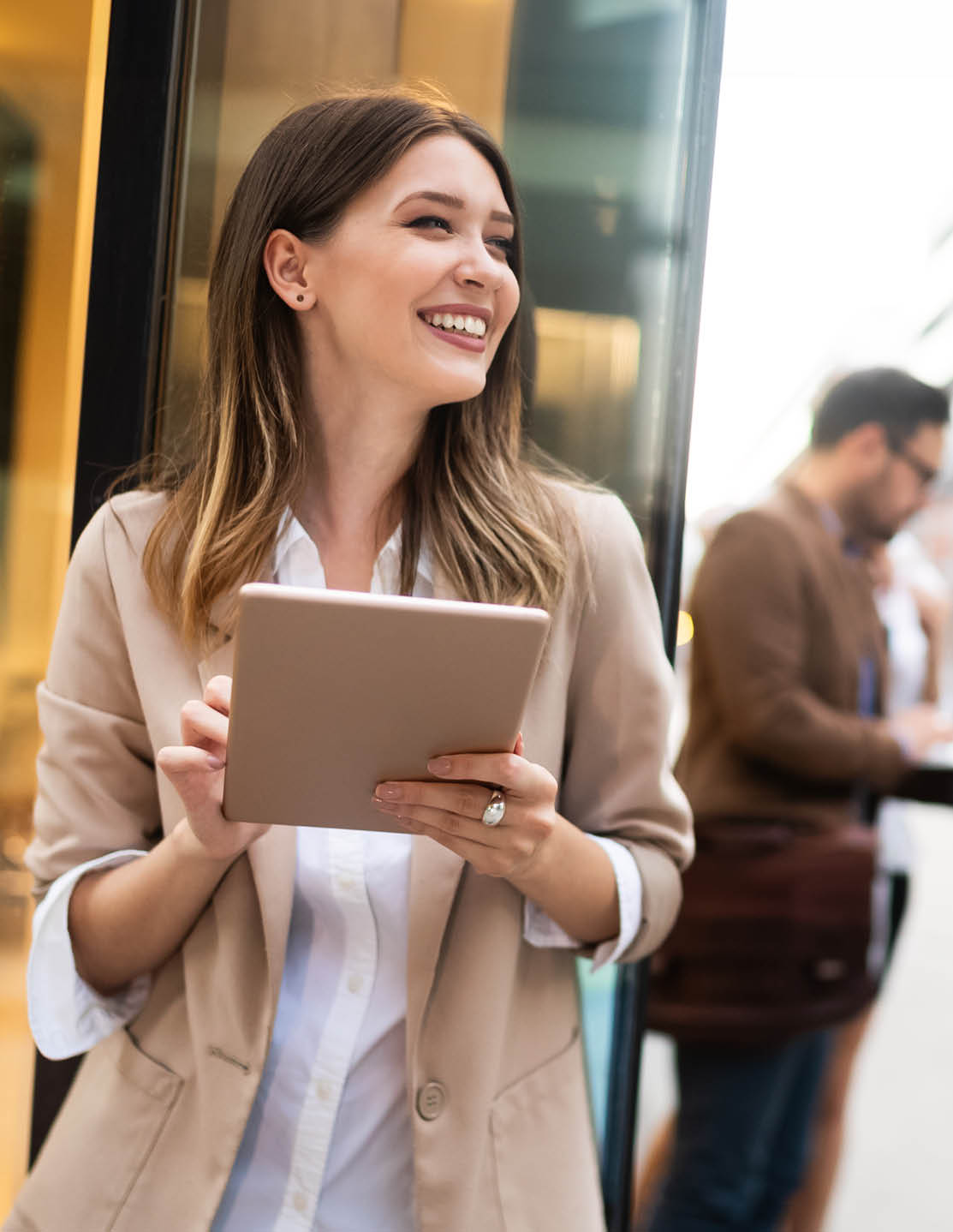 Urban business woman using tablet computer and working