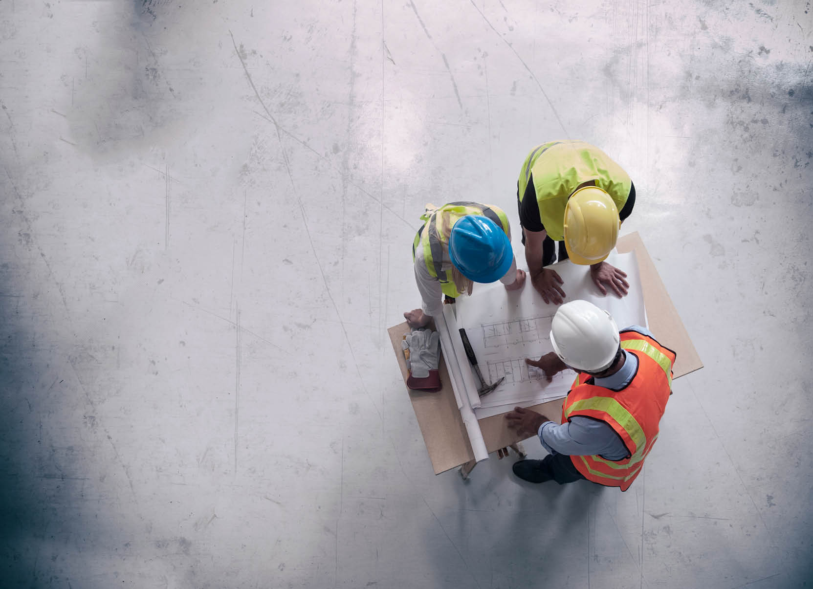 Engineers looking at blueprints