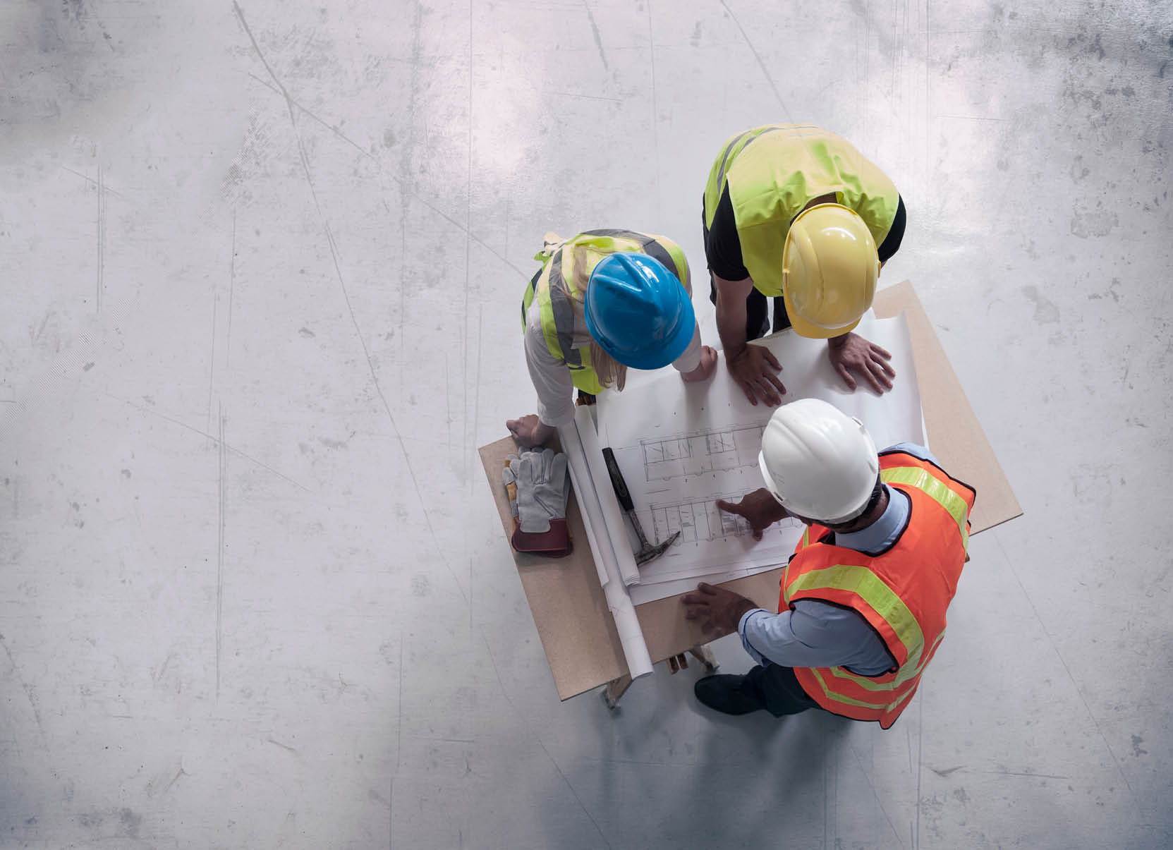 Engineers looking at blueprints