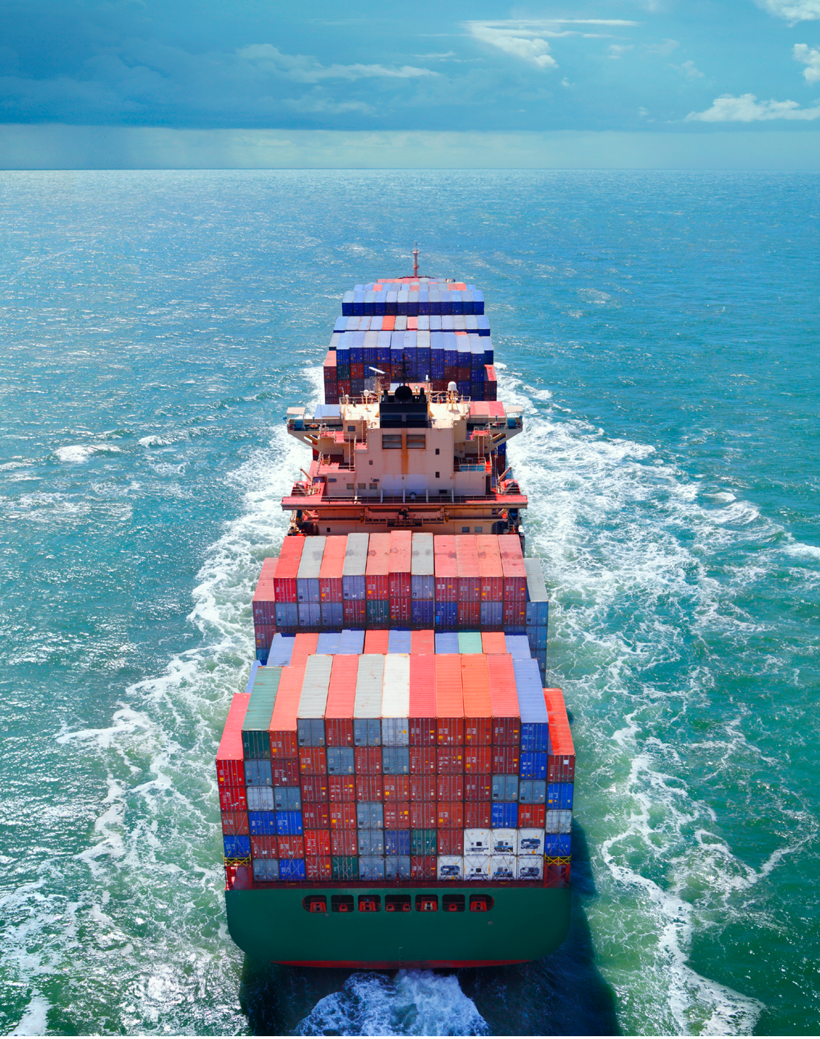 Aerial view of freight ship with cargo containers on the sea. See similar photos: : http://www.oc-photo.net/FTP/icons/cargo.jpg
