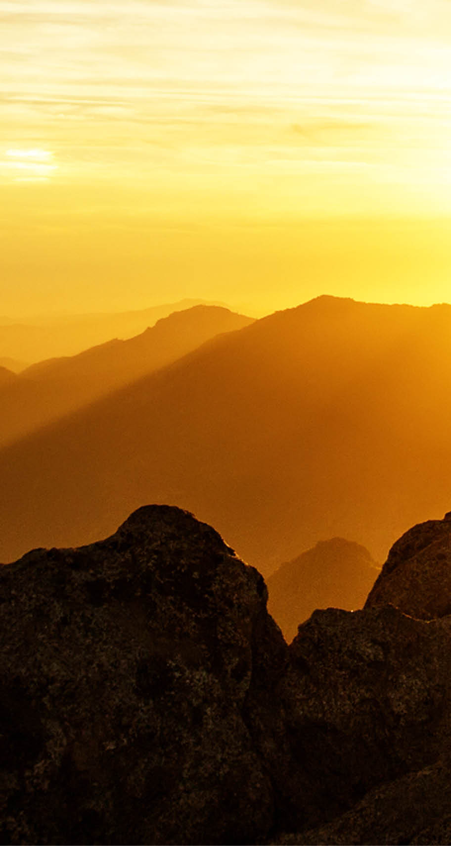 Hiker meets the sunset on the Moro rock in Sequoia national park, California, USA.
