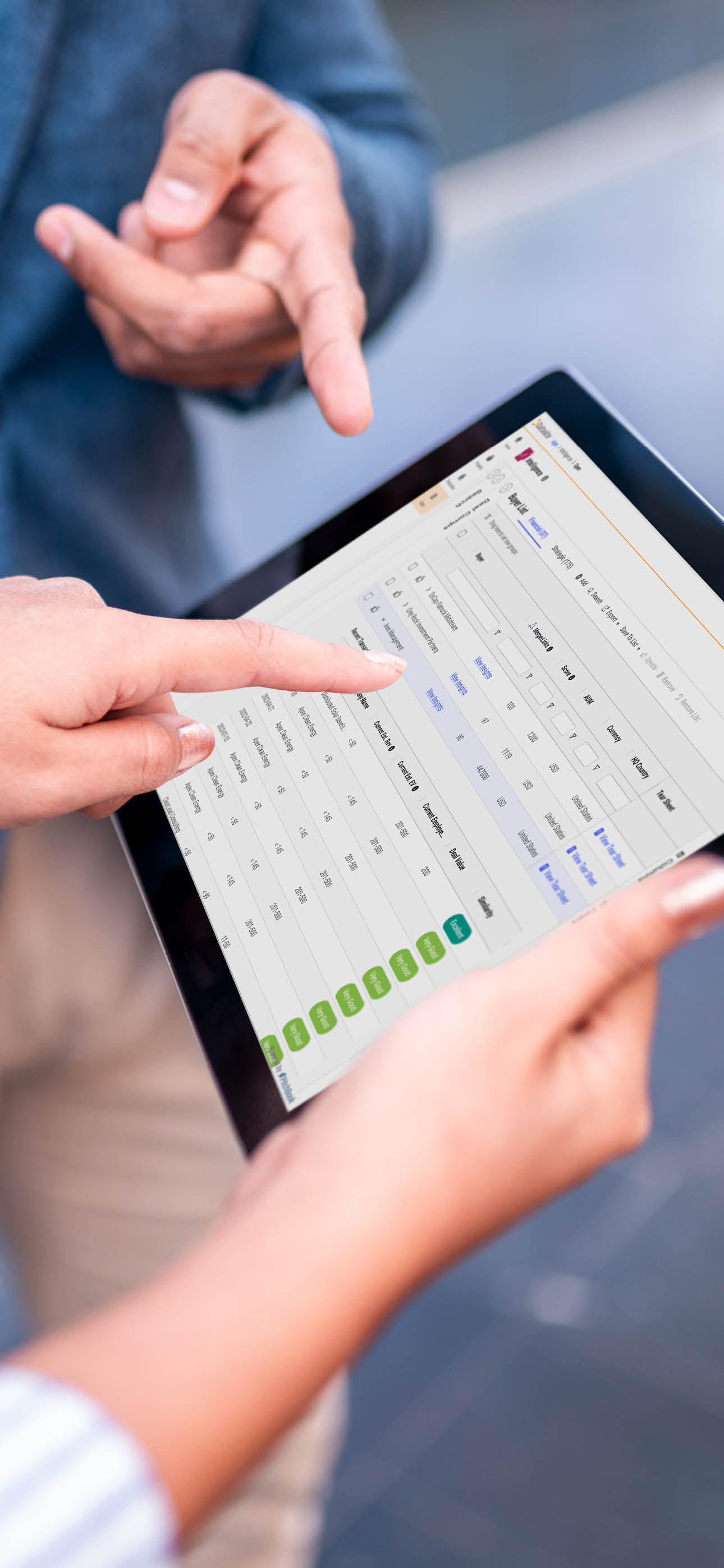 Shot of a digital tablet being held by a businesswoman, while businessman is showing something with his finger on the screen