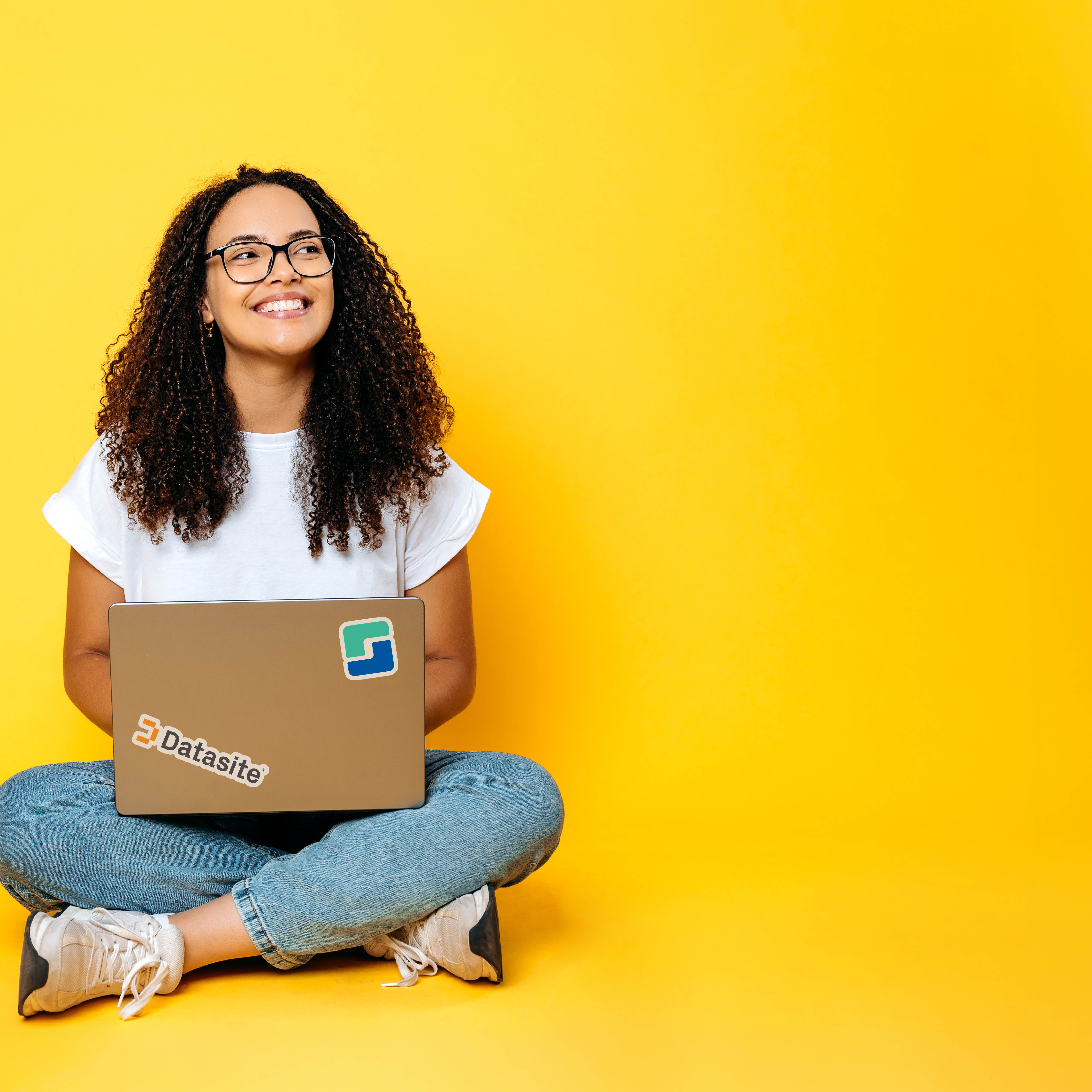 A woman is sitting on the floor with a laptop computer. AI generated content