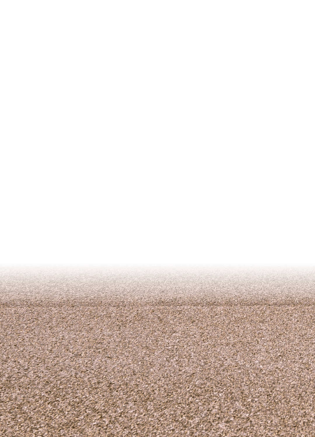 A horizon of rural land in Utah, USA, with the asphalt surface of the highway in the foreground.