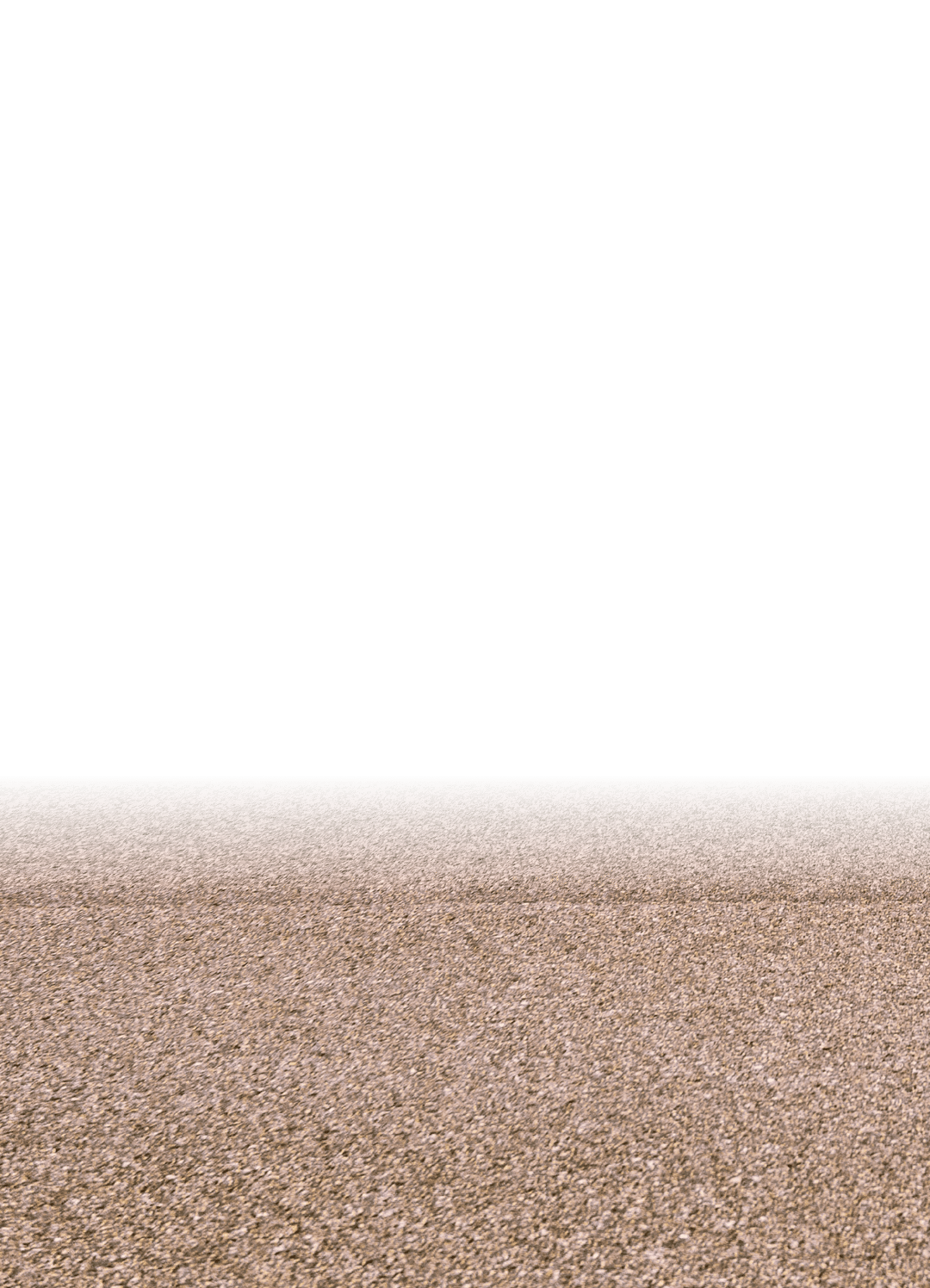 A horizon of rural land in Utah, USA, with the asphalt surface of the highway in the foreground.