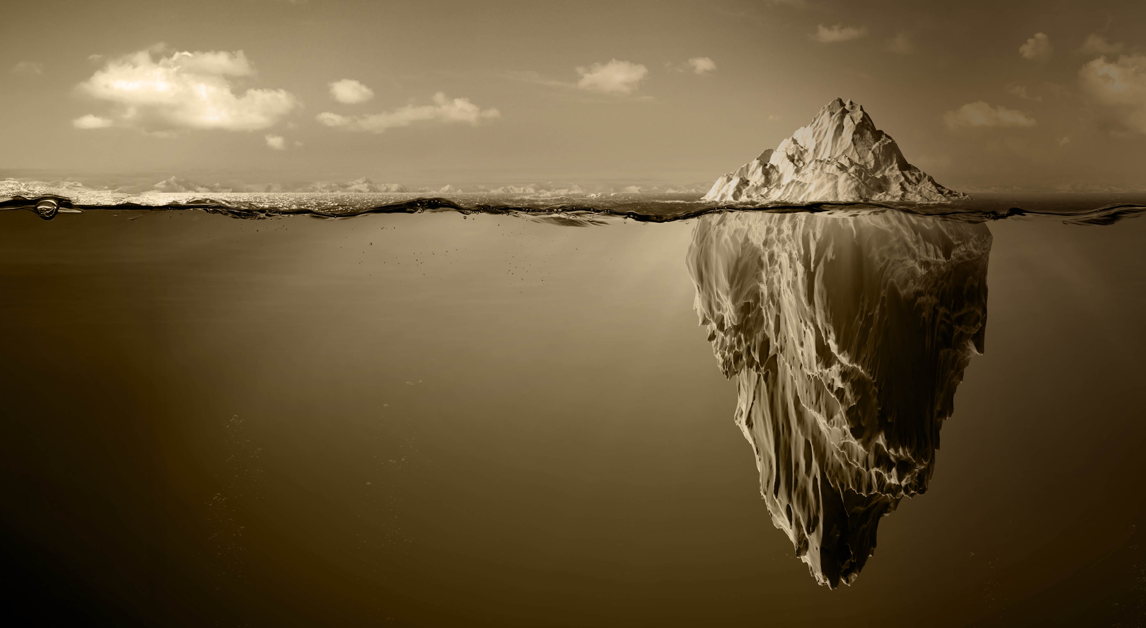 A large iceberg in the water. Description generated by AI