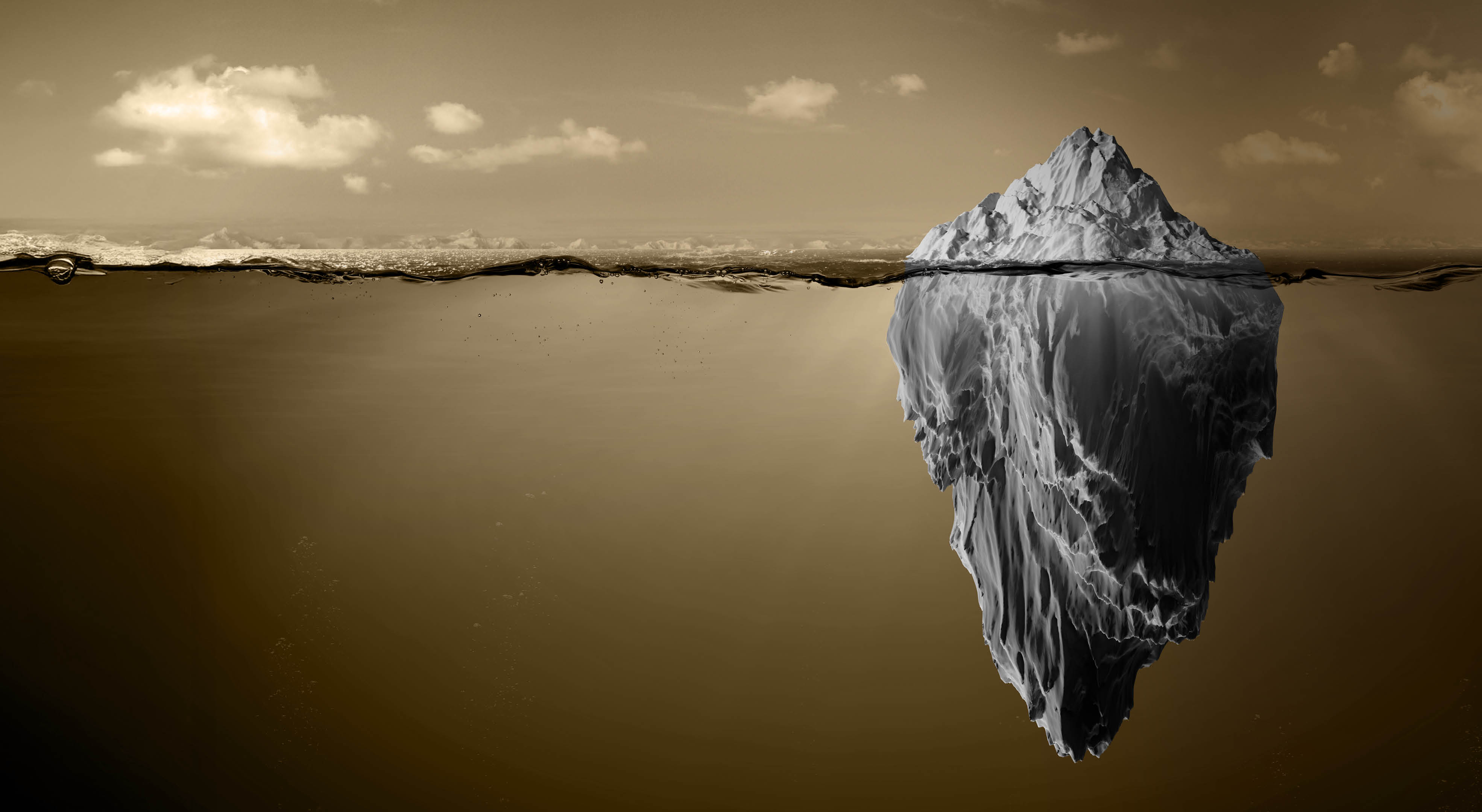 A large iceberg is shown floating in water with the majority of its mass submerged below the surface against a sepia-toned background. Description generated by AI