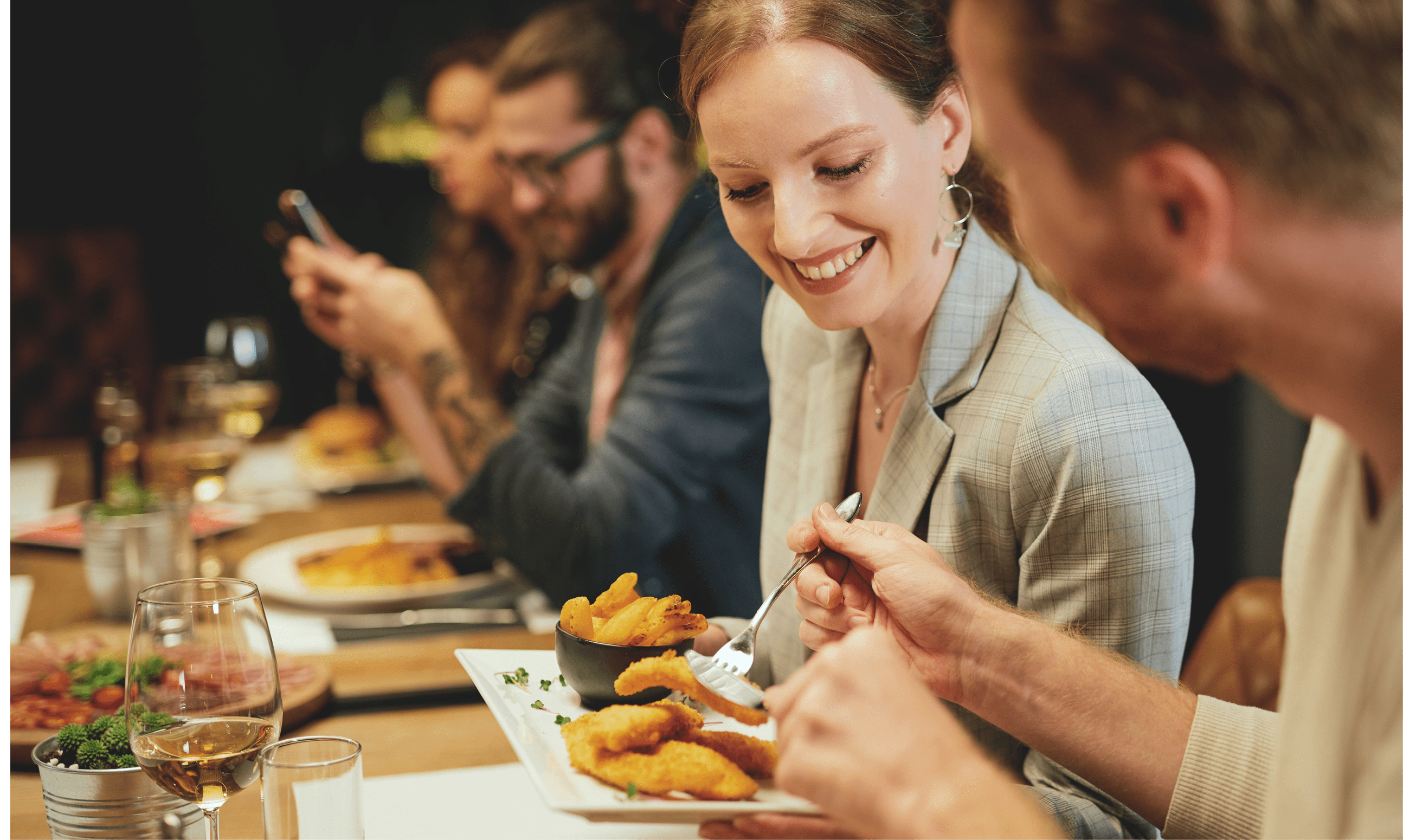Young couple sitting in restaurant and sharing food 